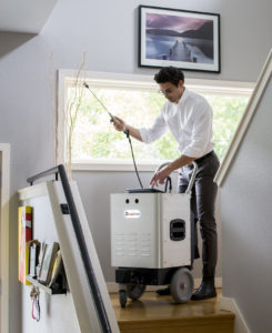 Inspector using the Instascope machine to detect mold in a home